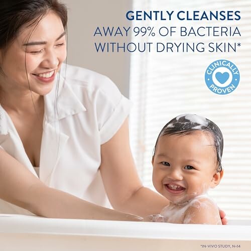 Mother bathing smiling baby with gentle cleanser